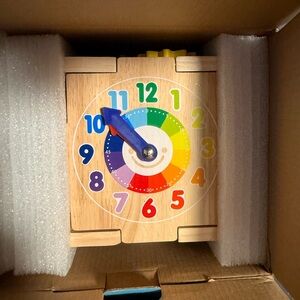 Wooden Rainbow Learning Clock Toy in Natural Wood and Multicolor